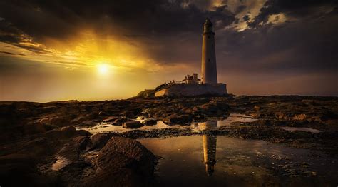 Lighthouse at sunset 1224453 Stock Photo at Vecteezy