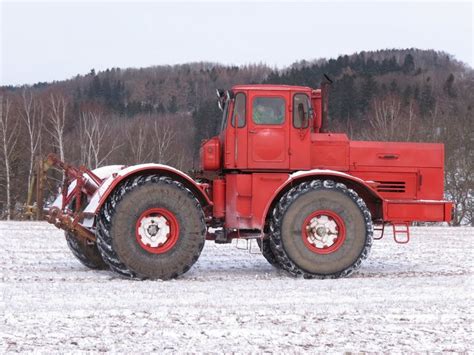 Vintage Red Tractor in Snowy Field