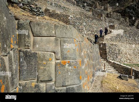 Stone walls and people on stairs, Ollantaytambo Inca ruins ...