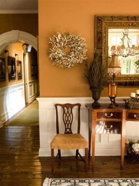 Traditional Farmhouse Style Foyer With Burnt Orange Paint Color