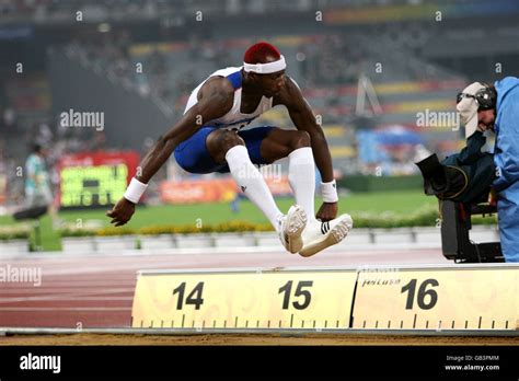 Great Britains Phillips Idowu On His First Jump During The Mens