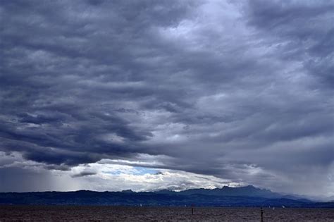 Stormy Weather With Heavy Rainy Clouds Above Lake Constance Observed From German Town ...