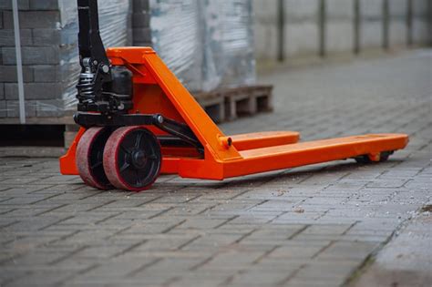 Premium Photo Old Orange Manual Hand Pallet Trucks Close Up Wheel Of