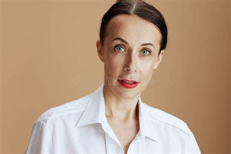 40 Years Old Woman In White Shirt Isolated On Beige Stock Photo Image Of Beautiful Mature
