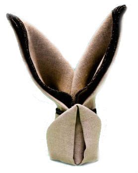 An Origami Rabbit Head Made Out Of Fabric With Black And White Stripes