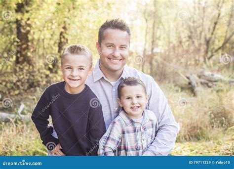 Outdoor Portrait Of A Father With His Two Sons Stock Image Image Of