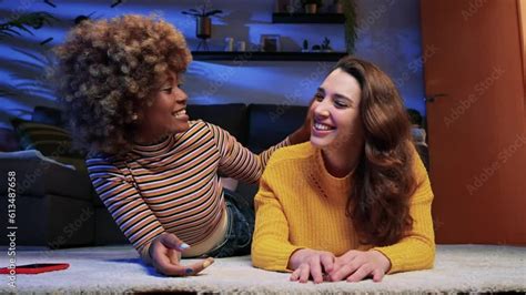 Happy Multiracial Lesbian Couple Looking Each Other Portrait Of Beautiful Young Couple Lying On