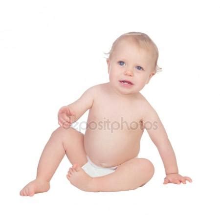 Adorable Blond Baby In Diaper Crying Sitting On The Floor Stock Photo