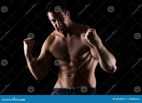 Angry Athletic Man In Attack Pose On Black Stock Image Image Of Kick