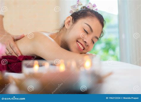 Masseur Doing A Back Massage To A Young Skinny Woman With Tanned Skin