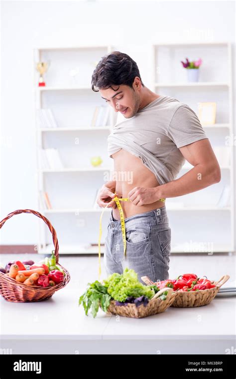 Young Man In Healthy Eating And Dieting Concept Stock Photo Alamy