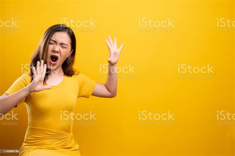 Angry Woman Screaming Isolated Over Yellow Background Stock Photo