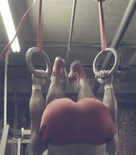 A Man Wearing Red Shorts And A Red Cap Hangs Suspended From Some Rings  On Imgur