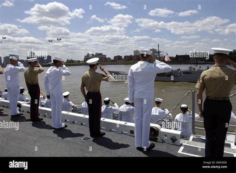 US Navy Sailors And Marines Aboard The Amphibious Assault Ship USS