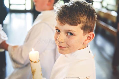 Little Kid Boy Receiving His First Holy Communion Happy Child Holding