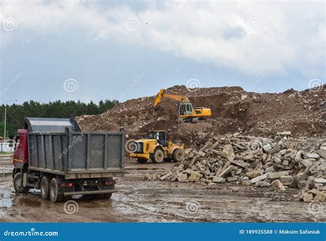 Excavator Dump Truck And Wheel Loader At Landfill For Disposal Of