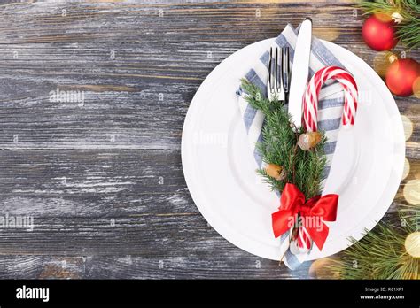 Christmas Setting Table With Candy Cane Lollipop Plates Fork Knife