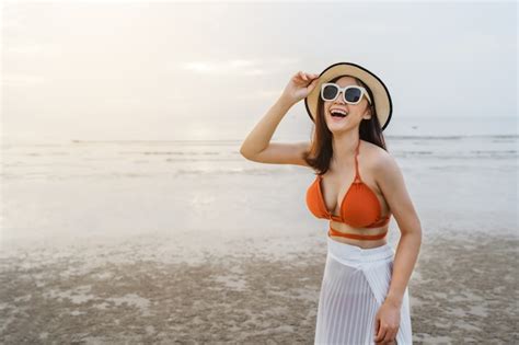 Premium Photo Cheerful Woman In Bikini Enjoying On The Sea Beach
