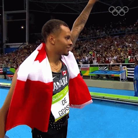 Waving Andre De Grasse GIF - Waving Andre De Grasse Olympics - Discover & Share GIFs