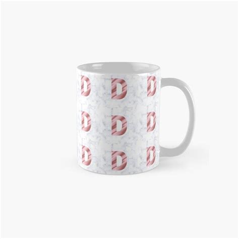 A White Mug With Pink And Red Circles On It