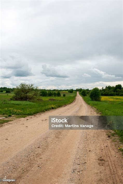 Country Gravel Road With Old And Broken Asphalt Stock Photo Download