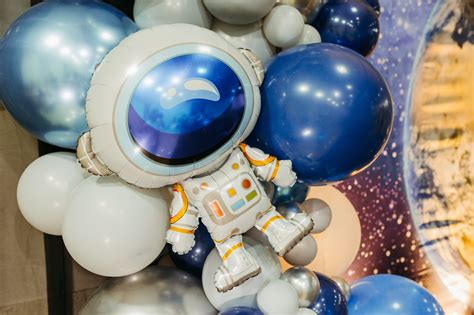 White Astronaut Toy on the Table · Free Stock Photo