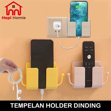 Jual HH TEMPELAN HOLDER HP DINDING TEMPAT REMOTE COLOKAN HANDPHONE