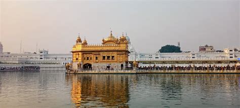 Golden Temple Reflecting in Water · Free Stock Photo