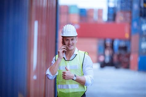 Premium Photo | Portrait team dock workers posing under working and ...