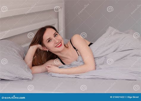 Pretty Redhead Woman In Black Lace Lingerie On Bed With Grey Sheets Stock Photo Image Of Slim