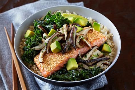 Salmon And Brown Rice Bowl With California Avocado Hollandaise Shiitake Relish And Ginger Kale