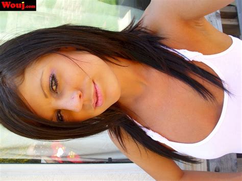 Solo Brunette Chick Showing Her Hard Nipples Under Her White Shirt Photos