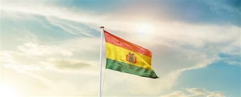 Premium Photo Bolivia National Flag Waving In Beautiful Sky