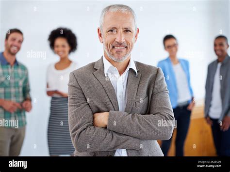 I Have A Team Of Winners Mature Man Standing Proudly In Front Of His