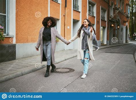 Love Holding Hands And Lesbian Couple Walking In Street Enjoying Holiday Vacation And