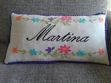 A Pillow With The Name Marina Embroidered On It