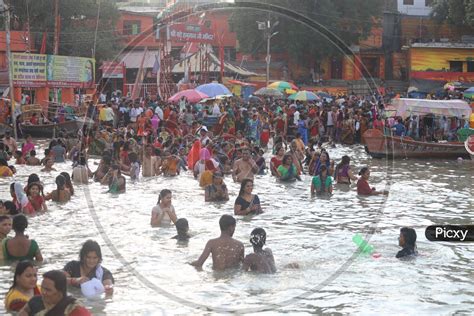 Image Of Hindu Devotees Or Pilgrims Taking Holy Bath In Triveni Sangam