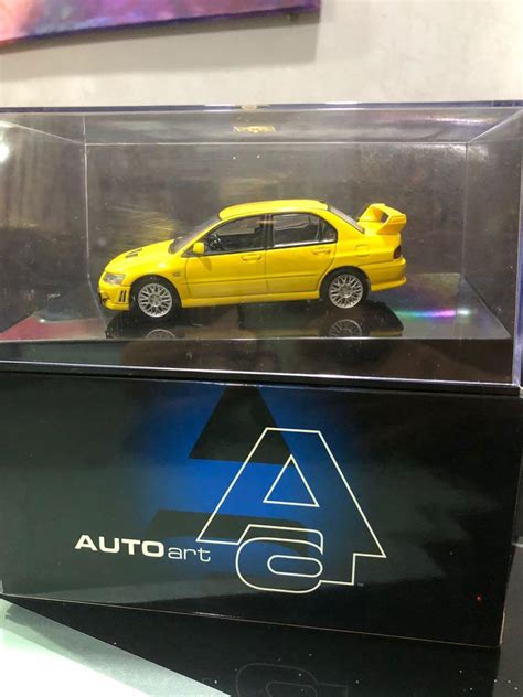 AUTOart 1 43 Mitsubishi Lancer Evolution VII Yellow Hobbies Toys