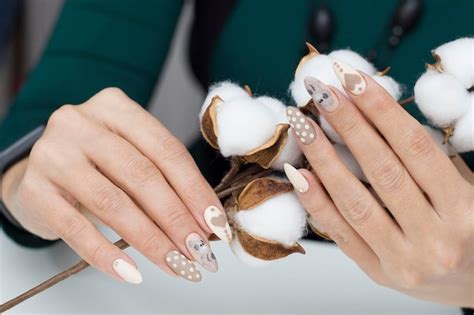 Premium Photo Manicure Drawing On The Nails Nude Nail Polish