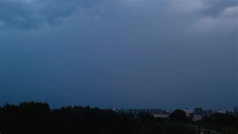 Bright lightning in dark night sky. Thunderstorm over city. Climate ...