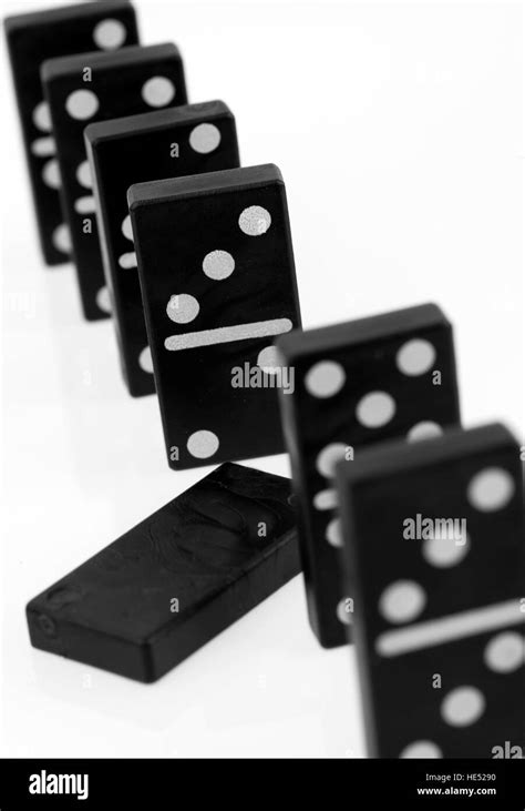 Dominos Falling Over Black And White Stock Photos And Images Alamy