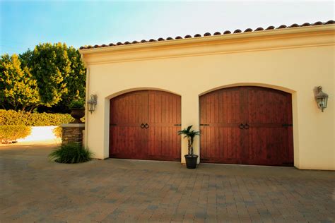 Spanish Style Stained Wood Garage Doors Mediterranean Exterior