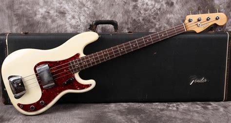 Red And White Bass Guitar On Case