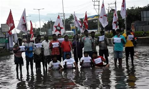 DYFI youth protests in stagnated rain water in Tirupati, demands to ...