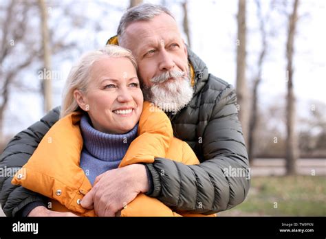 Happy Mature Couple Hugging Outdoors Stock Photo Alamy