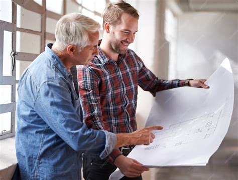 Premium Photo | Contractors project and men with a blueprint planning