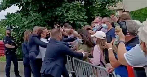 Macron slapped in the face during walkabout in southern France | Reuters