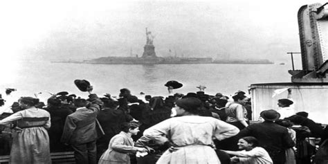 A Group Of Immigrants Traveling Aboard A Ship Celebrate As They Catch