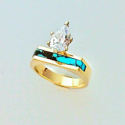 Gold And Turquoise Engagement Ring With A Pear Shape Diamond