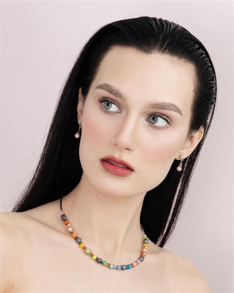 Premium Photo Portrait Of Sexy Brunette Woman With Makeup Posing With Hand On Bare Shoulder